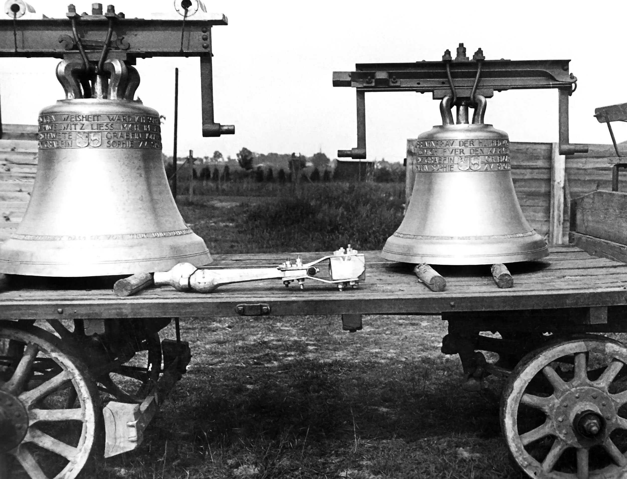 Archival photograph — church bells mounted on a transport cart
