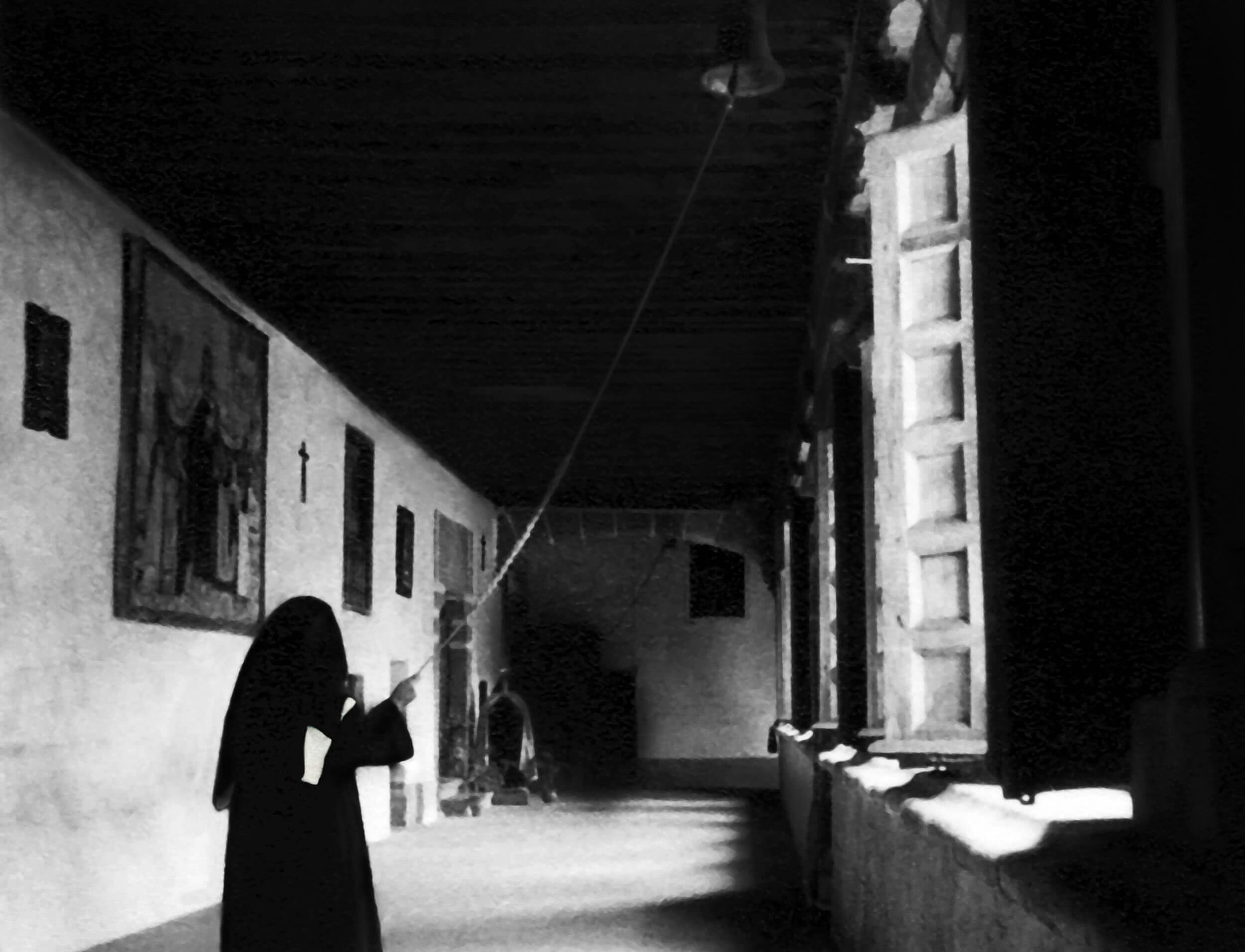 Archival photograph — hallway with figure and window light