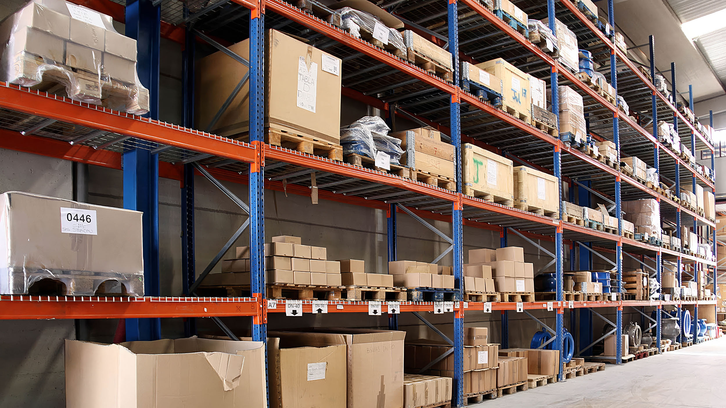 Warehouse racking stocked with valve components