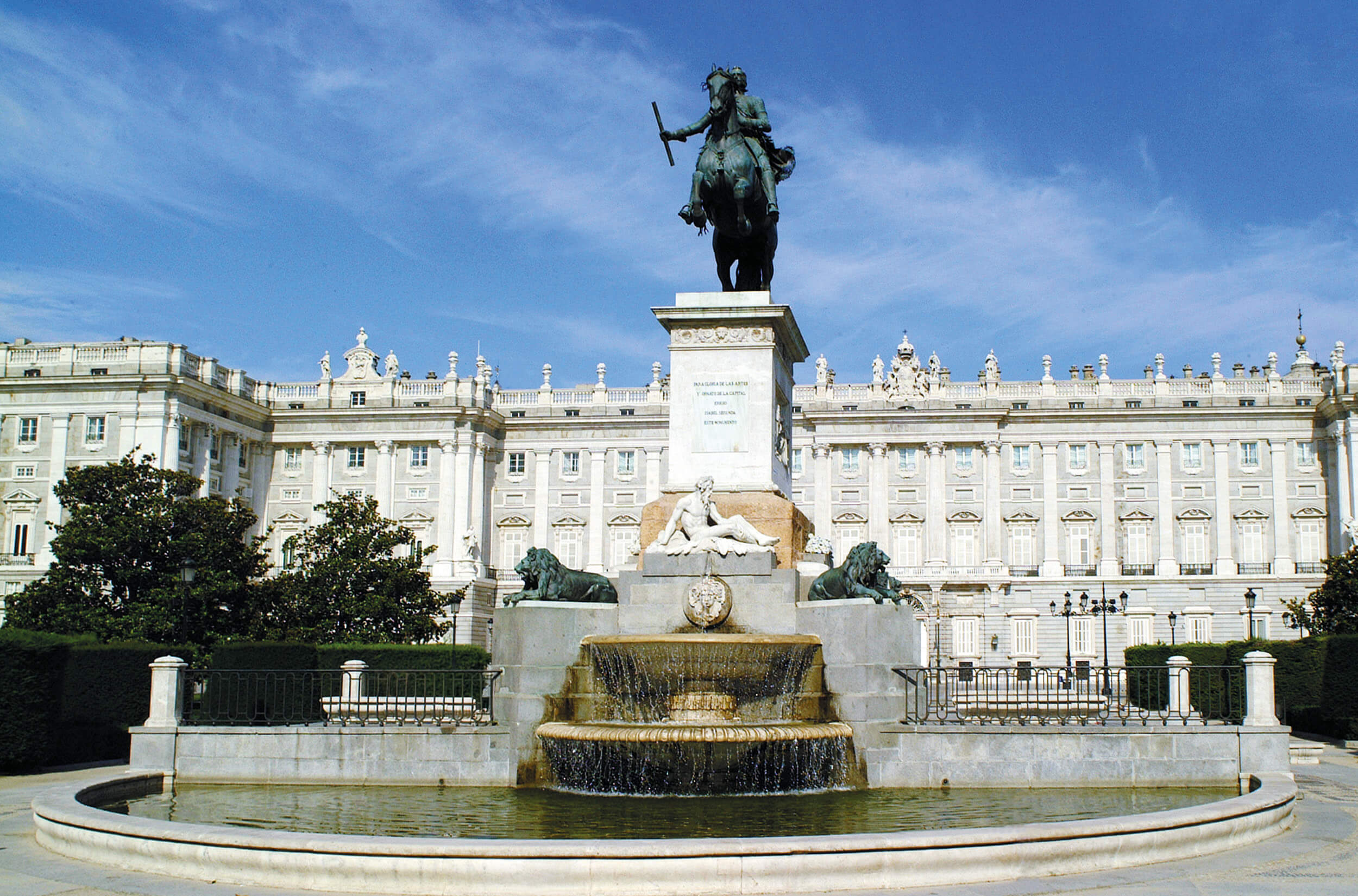 Madrid location photography — equestrian statue and Royal Palace fountains