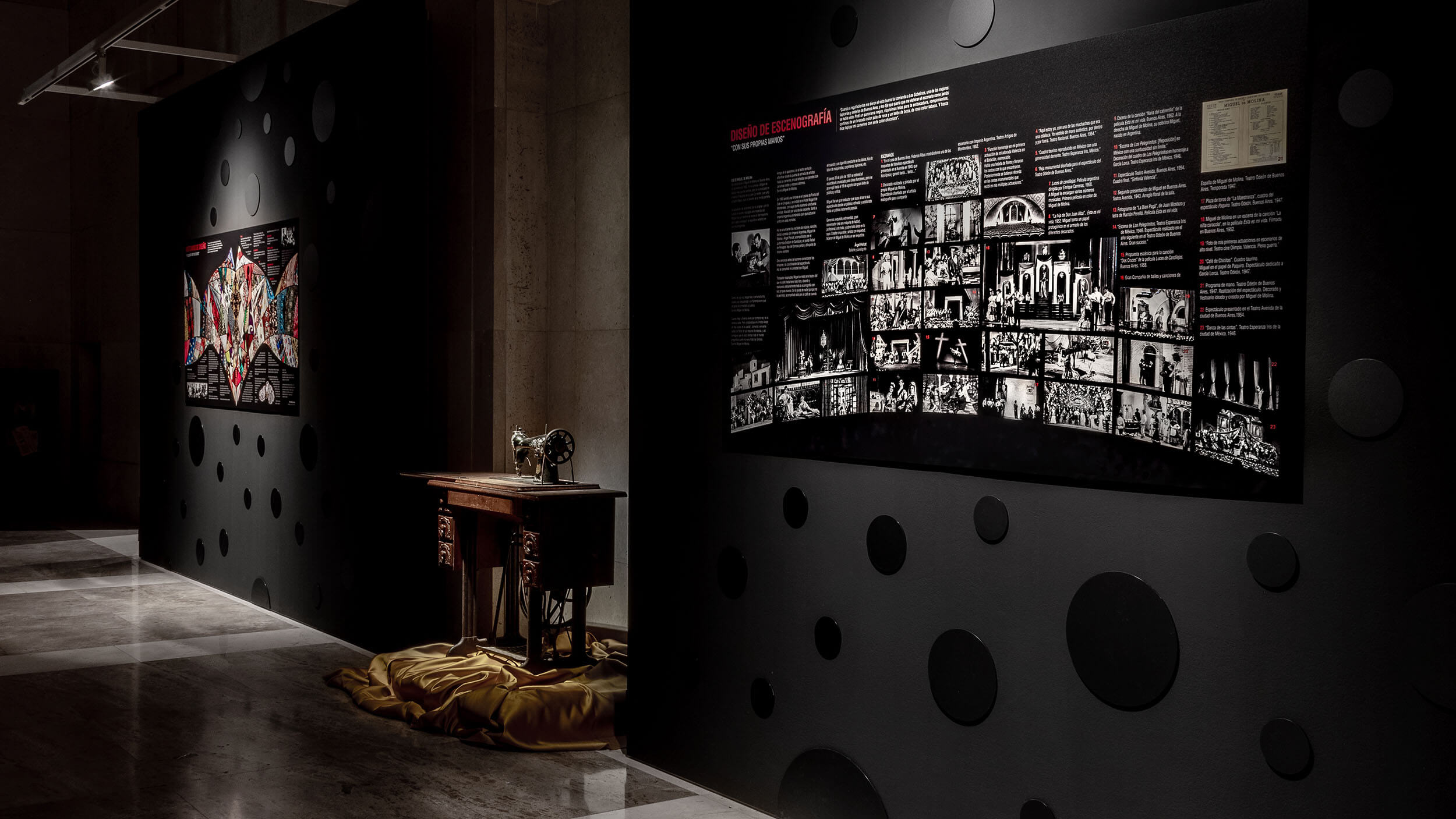Costume graphic wall panel with archive photo timeline and original sewing machine