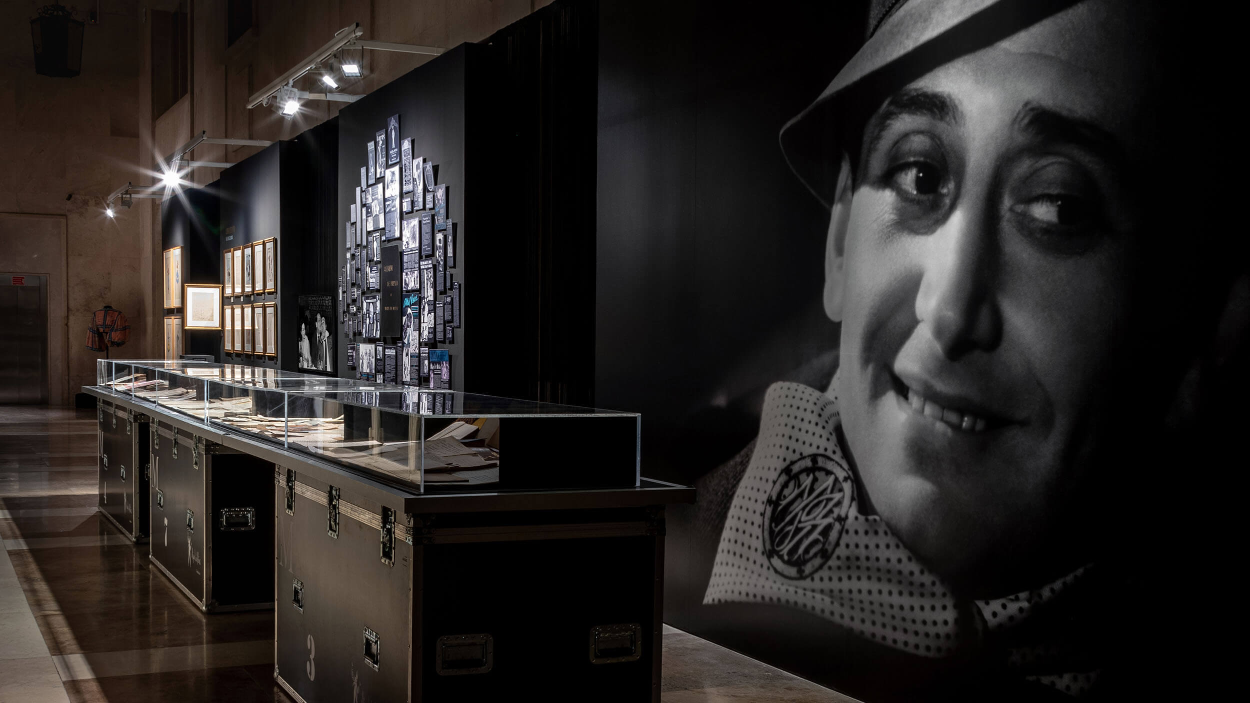 Vitrine display case with Miguel de Molina portrait photograph