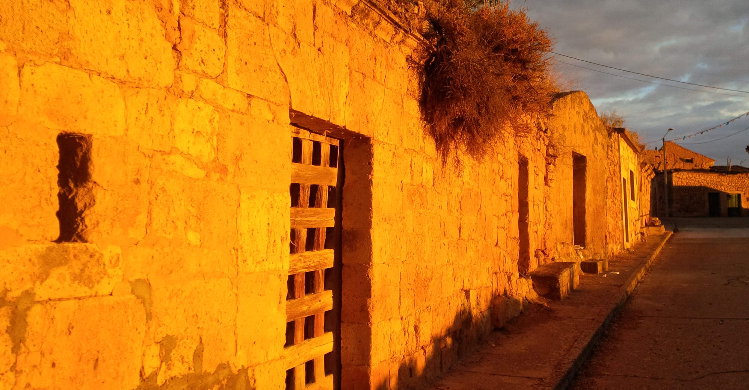 Golden hour — village stone wall, San Martín de Rubiales