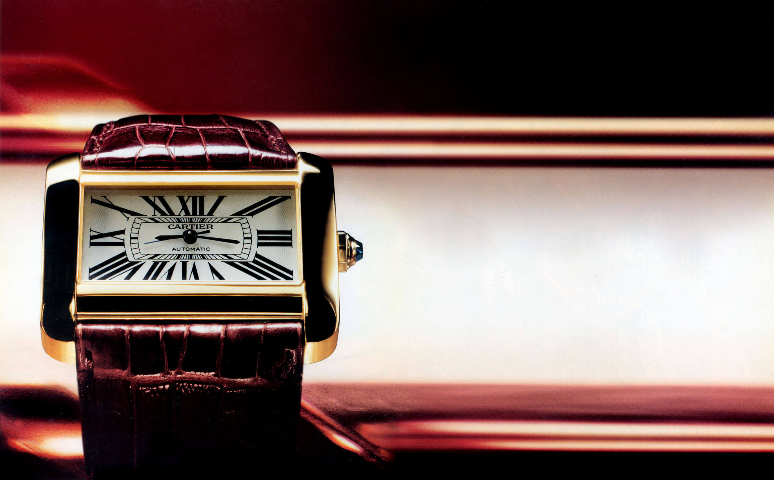 Cartier advertisement — Tank, gold and leather